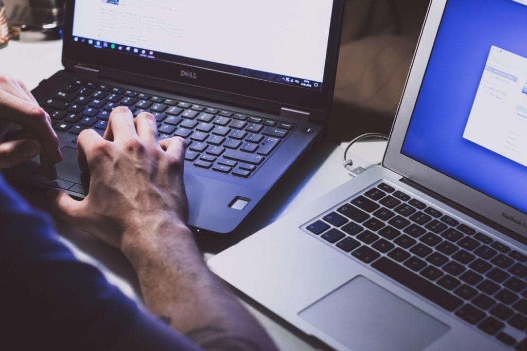 Man typing on computer