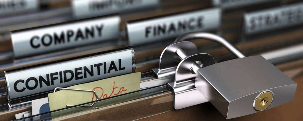 Keeping information secure. File cabinet with padlock.