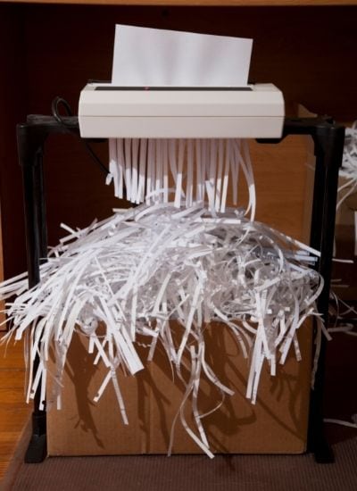 Office shredder with box of shredded paper